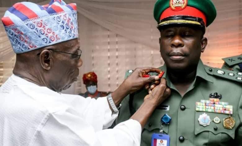 Jubilation as Obasanjo decorates son, Adeboye with Brigadier General rank