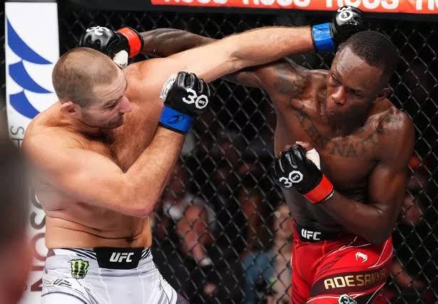 Sean Strickland drops Israel Adesanya on way to UFC title win
