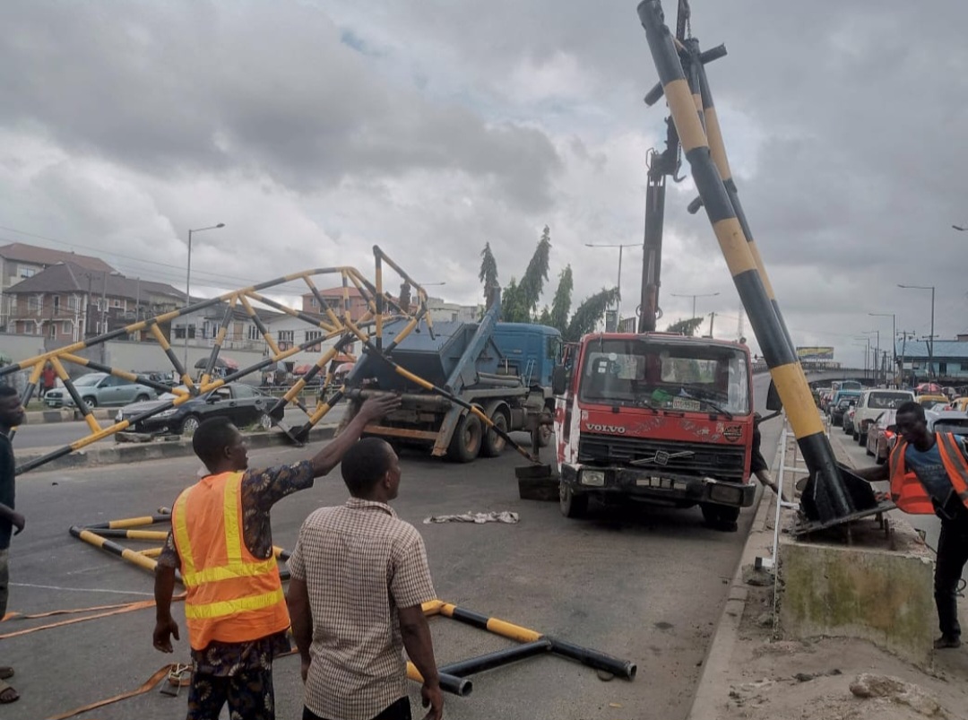 Driver lands in trouble after Trailer knocks down newly-errected barrier on Ojuelegba bridge